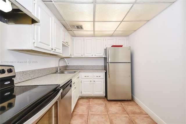 kitchen featuring visible vents, a sink, stainless steel appliances, white cabinets, and under cabinet range hood