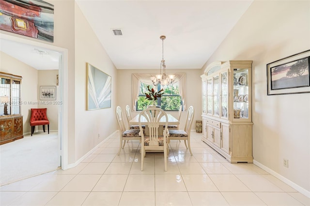 dining area featuring lofted ceiling, a healthy amount of sunlight, and visible vents