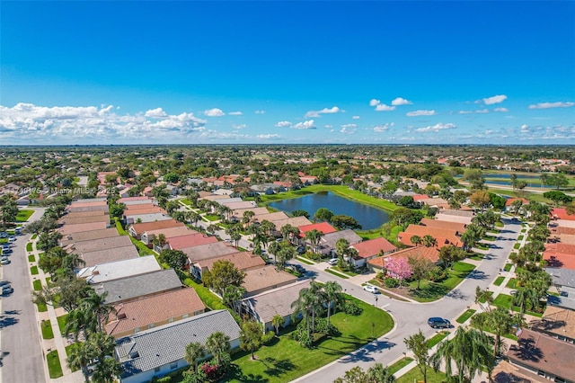 drone / aerial view with a residential view and a water view