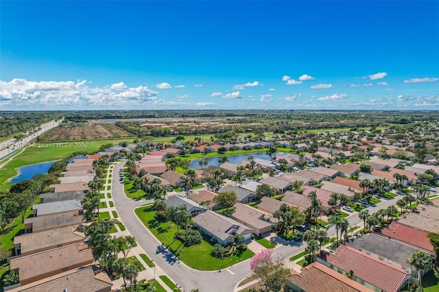 drone / aerial view with a residential view and a water view