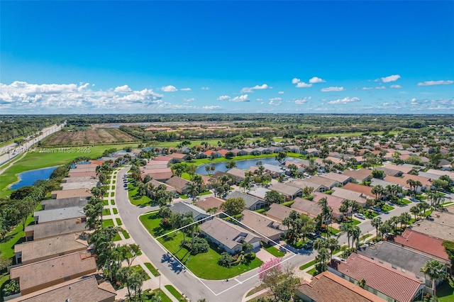 bird's eye view featuring a residential view and a water view