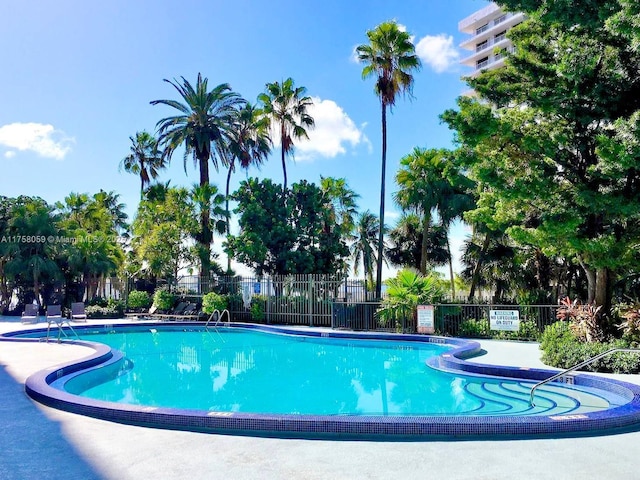 community pool featuring fence