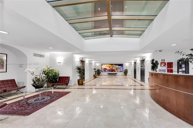 reception featuring arched walkways and visible vents