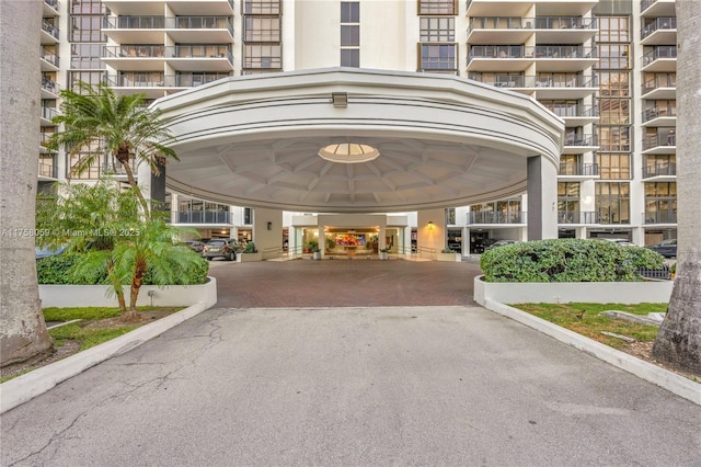 view of exterior entry with decorative driveway