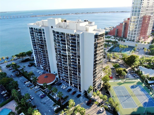 birds eye view of property featuring a water view and a view of city