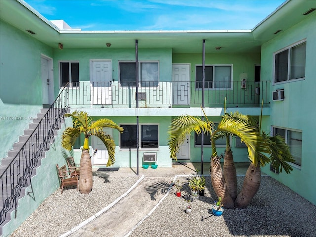 521 NE 82nd Ter, Miami, FL 33138 - back of house featuring stucco siding and stairway