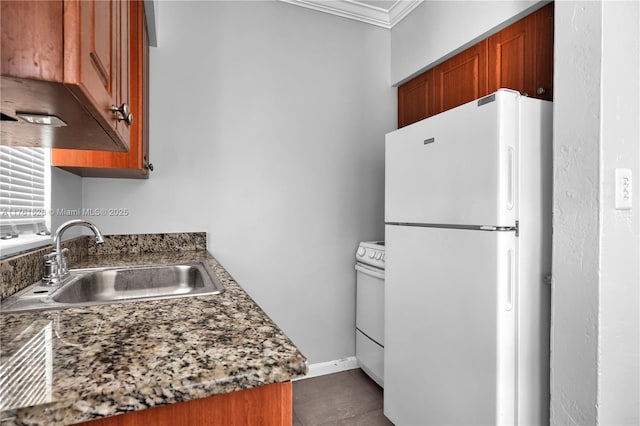 521 NE 82nd Ter, Miami, FL 33138 - kitchen featuring a sink, white appliances, ornamental molding, and brown cabinetry