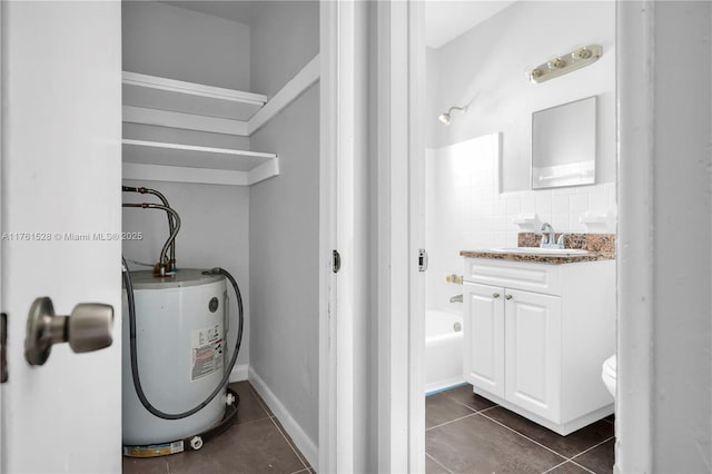521 NE 82nd Ter, Miami, FL 33138 - full bathroom featuring vanity, water heater, tile patterned flooring, shower / bathing tub combination, and toilet