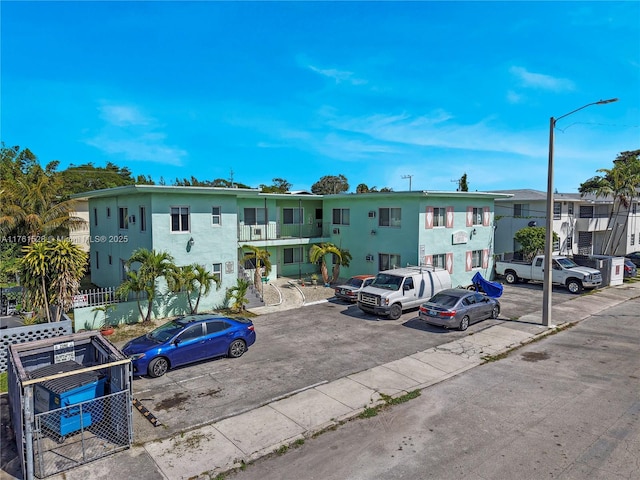 521 NE 82nd Ter, Miami, FL 33138 - view of building exterior with uncovered parking and a residential view