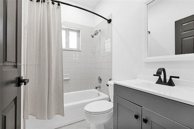 bathroom featuring vanity, toilet, and shower / bath combo with shower curtain