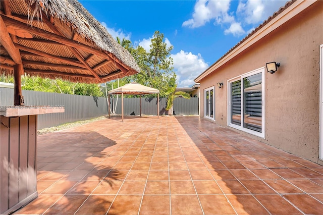 view of patio / terrace with a gazebo and a fenced backyard