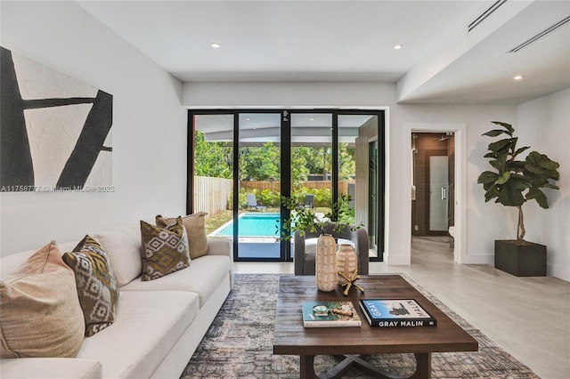 living room featuring french doors, recessed lighting, and visible vents