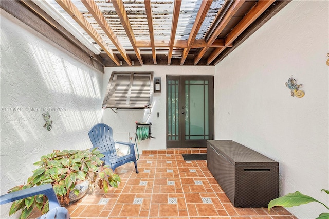 view of patio / terrace featuring french doors and a pergola