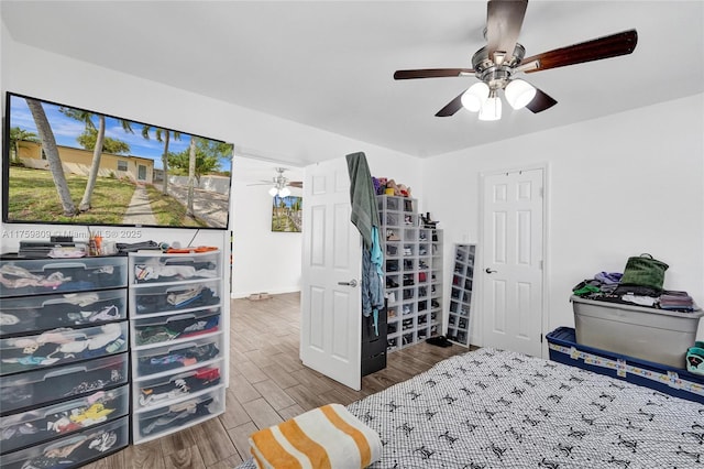 bedroom with ceiling fan and wood finished floors