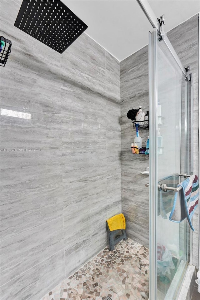 bathroom with a shower stall