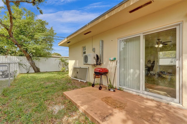 view of yard with a patio area, fence, and visible vents