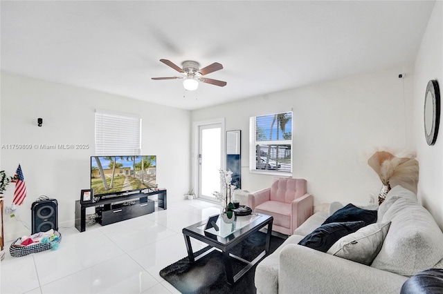 tiled living room featuring a ceiling fan