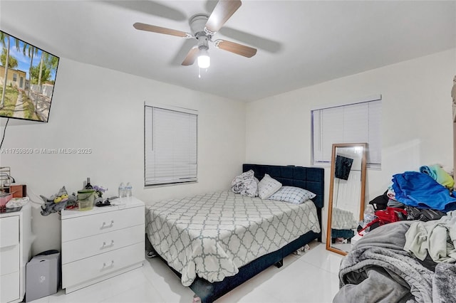 bedroom featuring light tile patterned floors and ceiling fan