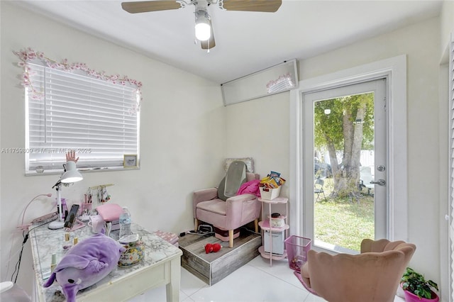 recreation room with a wealth of natural light and tile patterned flooring