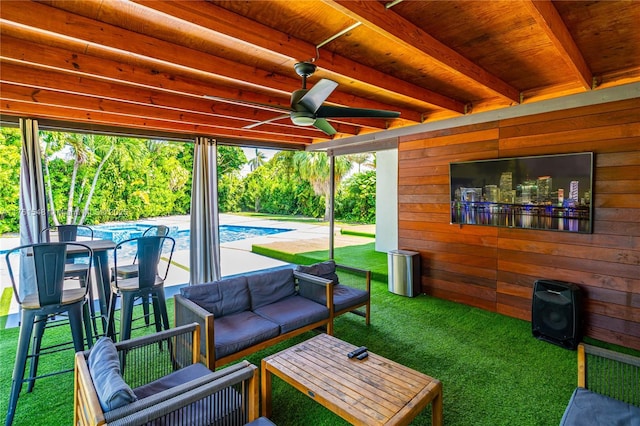 view of patio / terrace with an outdoor pool, ceiling fan, and outdoor lounge area