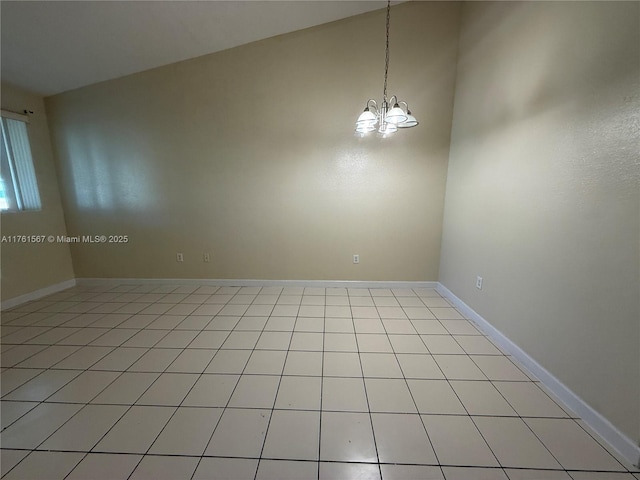 unfurnished room with baseboards and a chandelier