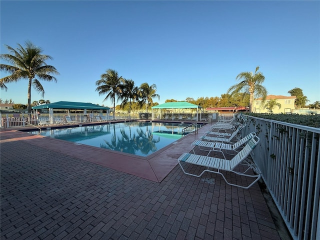 community pool featuring a patio area