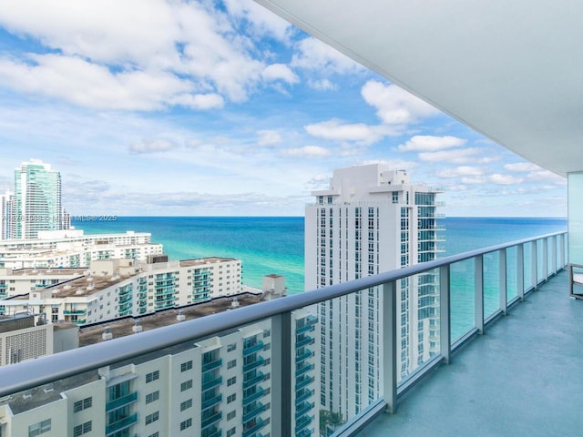 balcony featuring a water view and a view of city