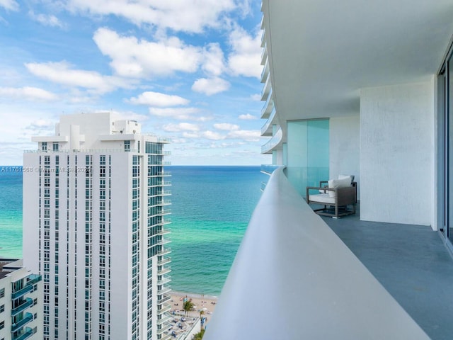 balcony featuring a water view