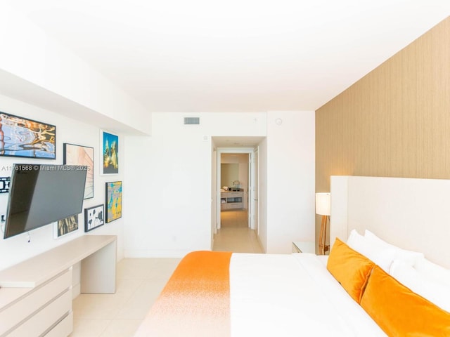 bedroom featuring light tile patterned floors and visible vents