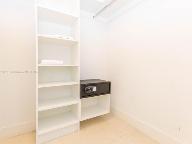 walk in closet featuring tile patterned flooring