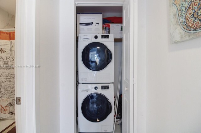 washroom featuring laundry area and stacked washing maching and dryer