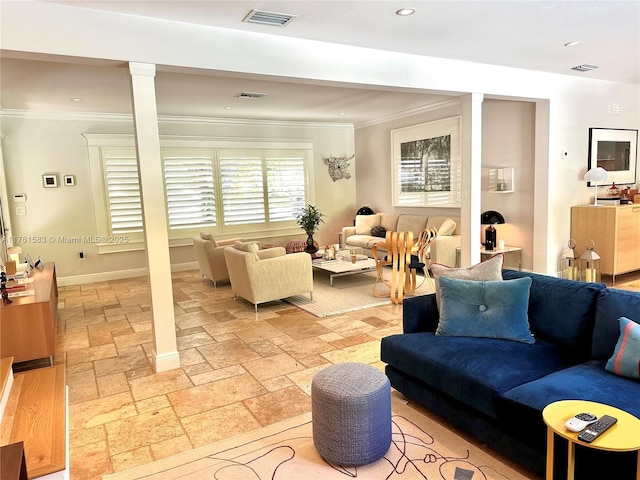 living room featuring stone tile floors, decorative columns, visible vents, and ornamental molding