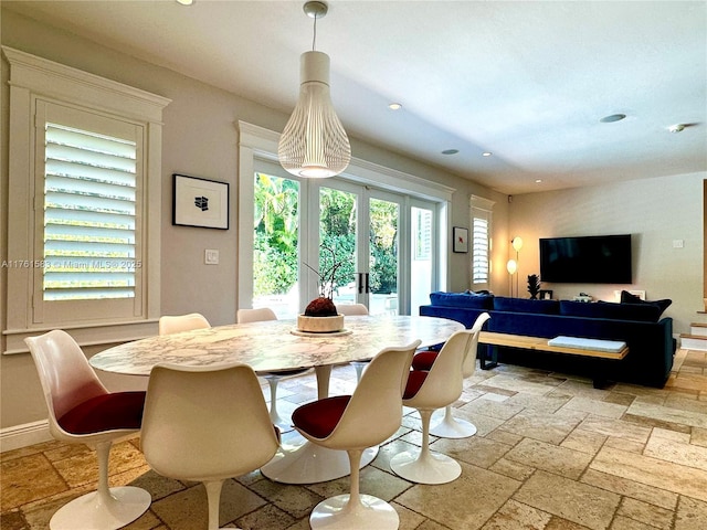 dining room with stone tile floors, recessed lighting, baseboards, and french doors