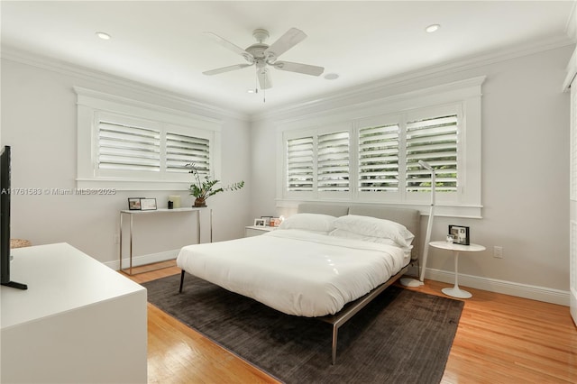 bedroom featuring recessed lighting, baseboards, light wood-style floors, and ornamental molding