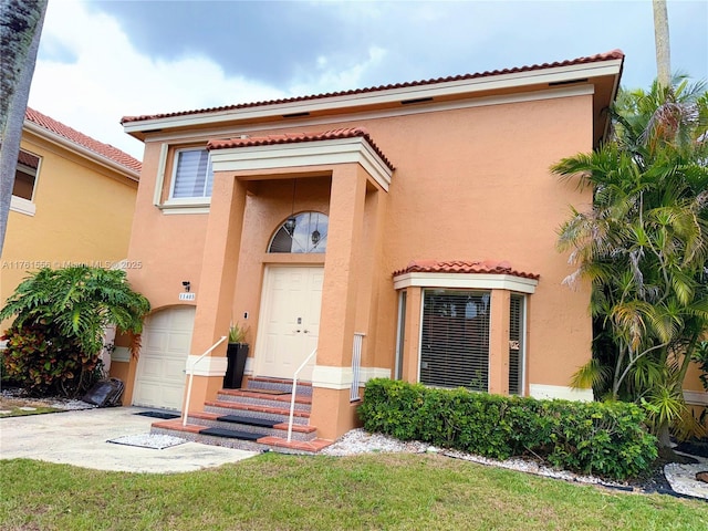 view of front of home featuring stucco siding, a garage, concrete driveway, and a tile roof