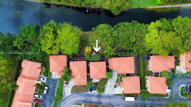 birds eye view of property featuring a residential view and a water view