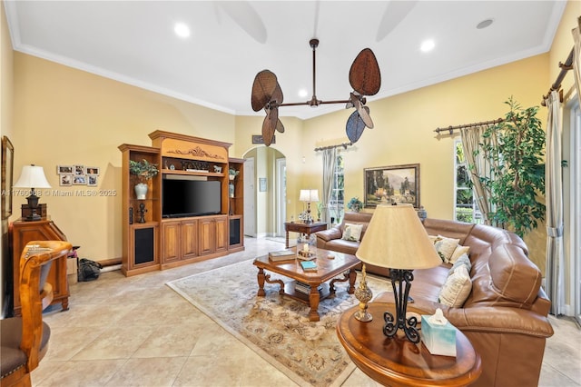 living room with crown molding, light tile patterned flooring, recessed lighting, and arched walkways