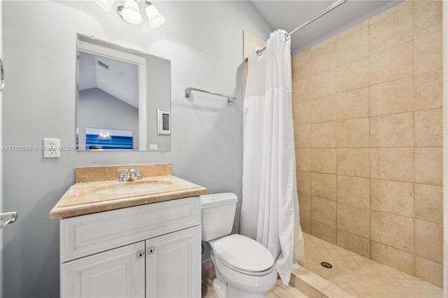 full bath with a shower stall, vanity, and toilet