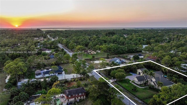 drone / aerial view with a view of trees