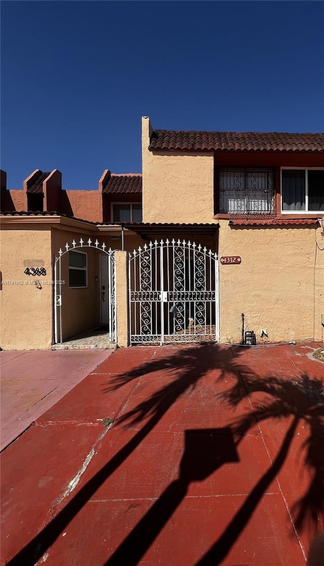 view of patio / terrace with fence and a gate