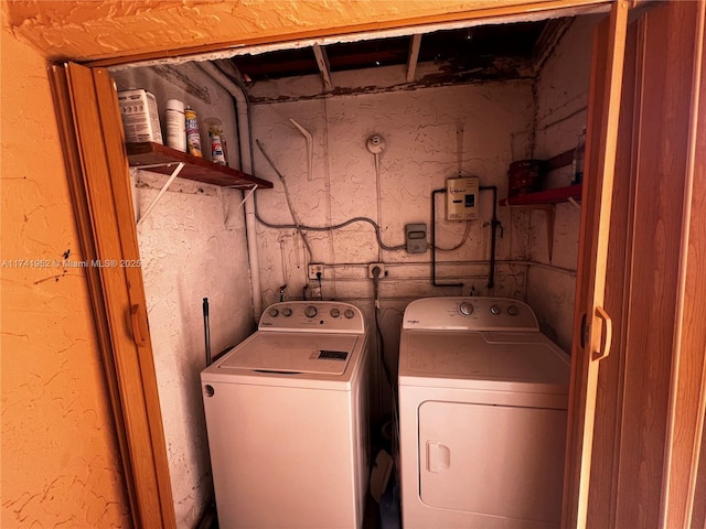 laundry area featuring laundry area and washer and clothes dryer