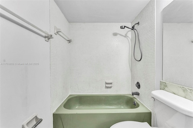 bathroom with shower / bath combination and toilet