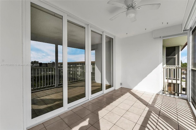 balcony featuring a ceiling fan