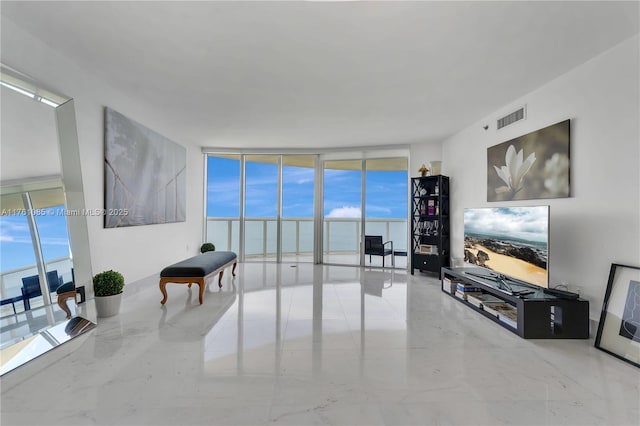 17201 Collins Ave Unit 3708, Sunny Isles Beach, FL 33160 - living room featuring a wall of windows and healthy amount of natural light