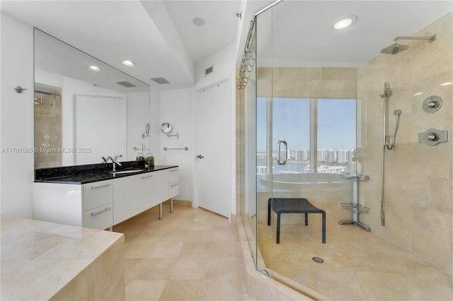 full bath with vanity, recessed lighting, visible vents, and a stall shower