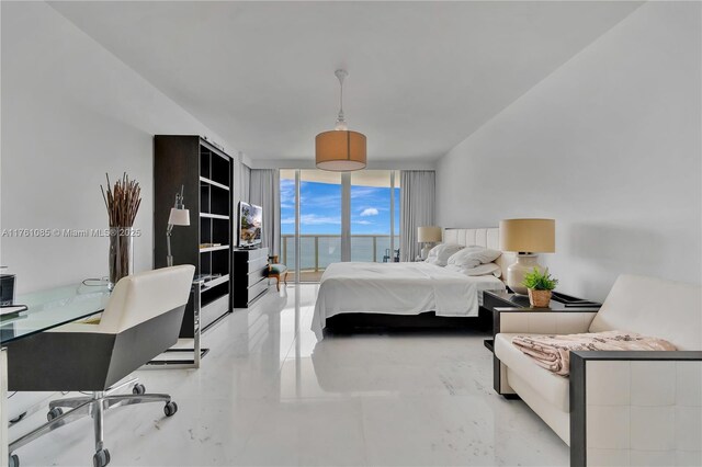 bedroom featuring a wall of windows