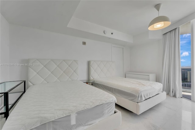 17201 Collins Ave Unit 3708, Sunny Isles Beach, FL 33160 - bedroom featuring access to outside, light marble finish floors, and a tray ceiling