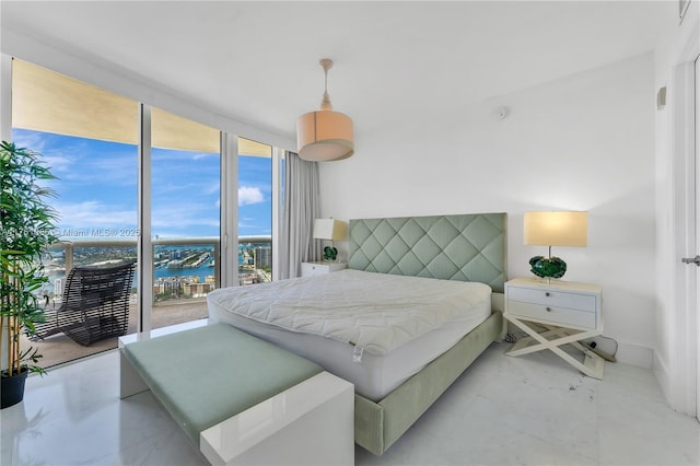 17201 Collins Ave Unit 3708, Sunny Isles Beach, FL 33160 - bedroom featuring a water view and expansive windows