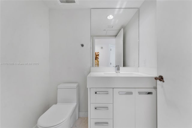 17201 Collins Ave Unit 3708, Sunny Isles Beach, FL 33160 - half bathroom with vanity, toilet, and baseboards