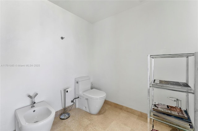 17201 Collins Ave Unit 3708, Sunny Isles Beach, FL 33160 - bathroom with a bidet, toilet, and baseboards